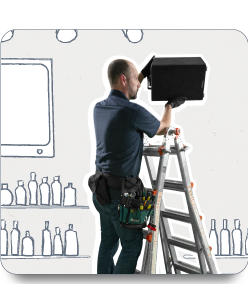 Image of a man installing speakers